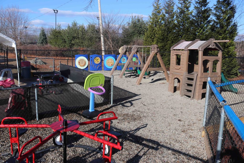 Wilmington TLC big playground with swings and structures