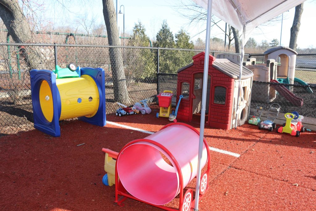 Wilmington TLC toddler playground, playhouses on red turf