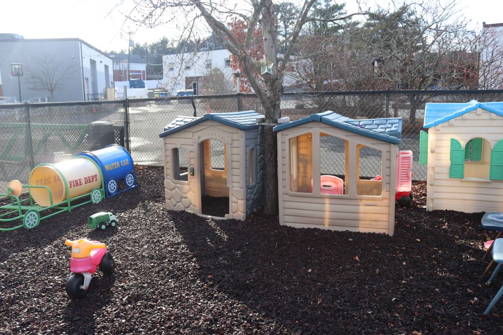 Burlington tender learning centre toddler playground with play houses on rubber mulch