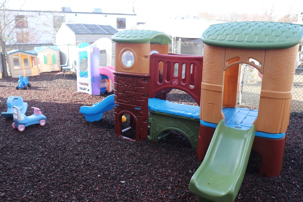 Burlington Tender Learning Centre Toddler playground with structures on rubber mulch