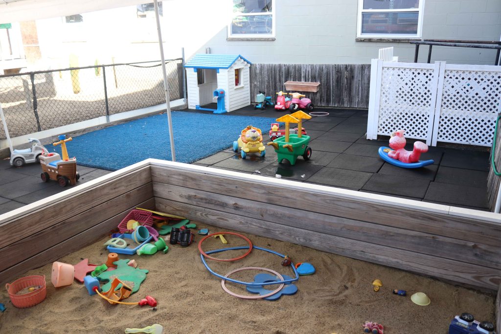 Burlington Tender Learning Centre Toddler playground with sandbox and ride on toys