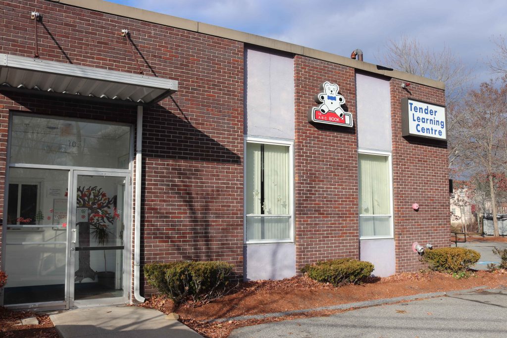 Brick building with teddy bear logo tender learning centre